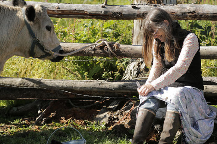 Charlotte puts some final details into the cow bra, hand sewing as needed to make it fit just right.