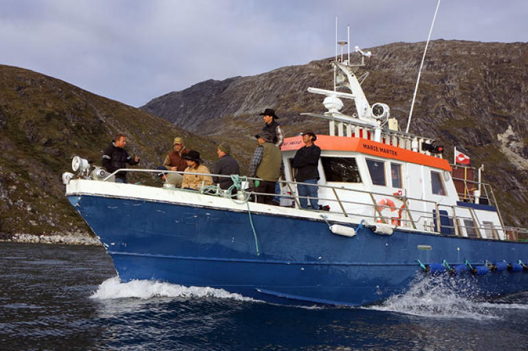 The miners on their first boat trip out to Storo.