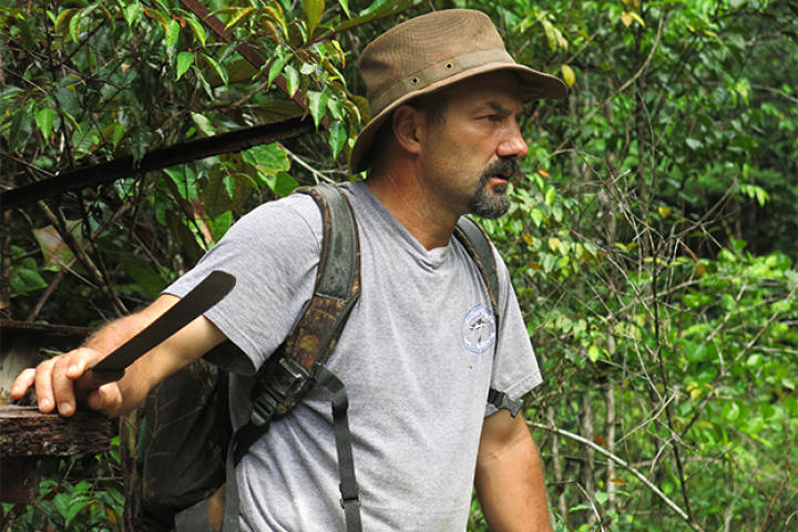 Dave Turin clearing a path in the jungle