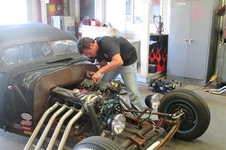 Jeff Thisted works on the engine of a Rat Rod - a style of hot rod that's meant to look a little rough around the edges, even when it's finished.