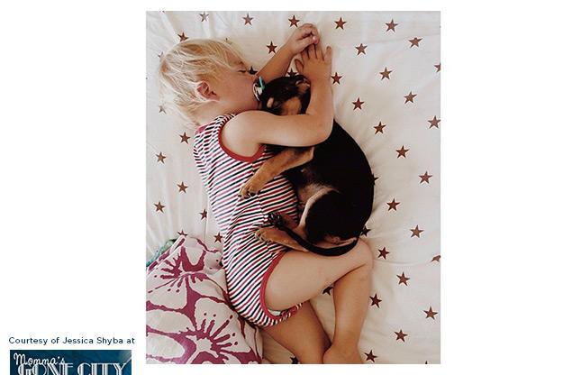 Beau's mother captured these adorable images of the two cuddling in bed.
