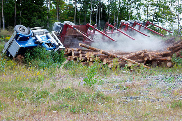 Veteran driver Danny Pelletier narrowly escapes death when his truck rolls on a back logging road.