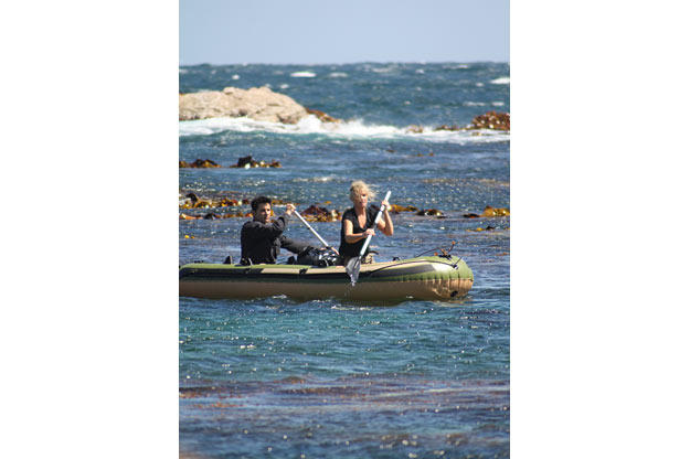 The Hawkes paddle into the rough surf off the Tasmanian coast, just before their raft is "damaged" to simulate the type of traumatic event which often precedes survival situations. The premise for these survival missions is simple: most rescues happen within a few days, and what you do during these first hours often determines if you make it or not.