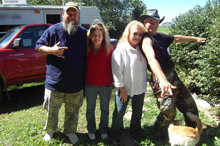 Turtleman (Ernie Brown, Jr.) and Neal James pose with cat owner Sue Craig and Patty Beery.