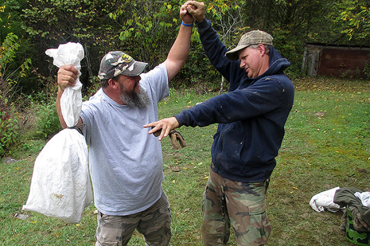Ernie Brown, Jr., the Turtleman, and Neal James have bagged Boone the groundhog.