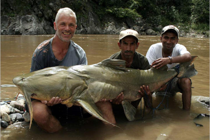 Jeremy Wade with a 161-pound goonch catfish. This catch measured 5 feet, 7 inches from head to tail with a 41-inch girth and 44-inch "wingspan."