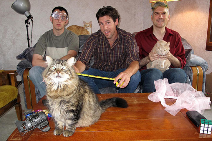 John hams for the camera with Cat Engineers Paul Klusman and Thomas Wingard.