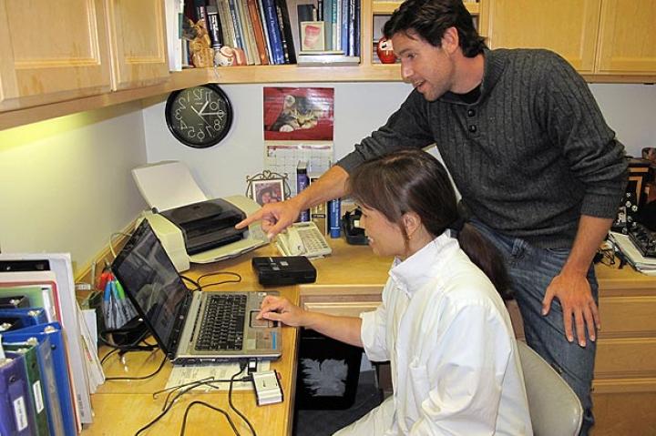 John Fulton with Dr. Jean Chu reviewing security footage