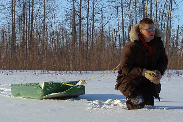 Bob Wright hauls wood through the snow.