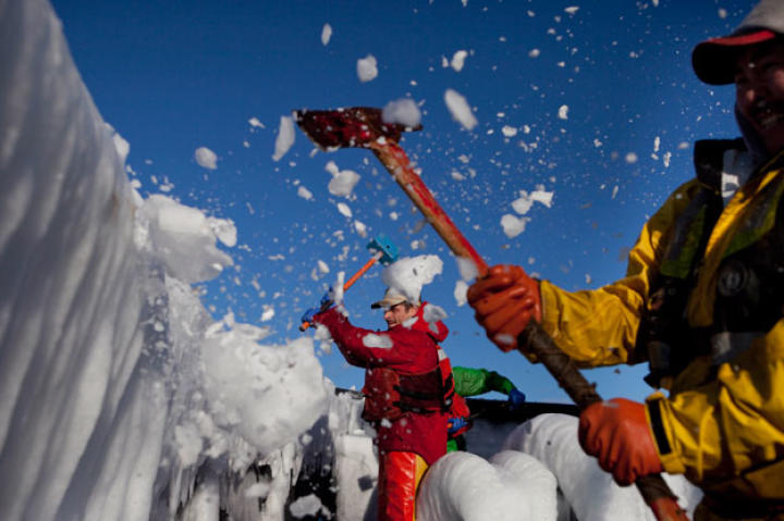 Wizard crewmen use axes and ice hammers to clear away the thick coating of ice that covered the boats in their first days out. Just as the Opie season started, a massive Arctic storm swept across the Bering Sea bringing heavy seas and freezing spray.