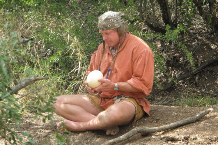 Cody's like a kid in a candy factory when he finds an ostrich egg, a bone-hard shell used by local Bushmen as a water carrier.
