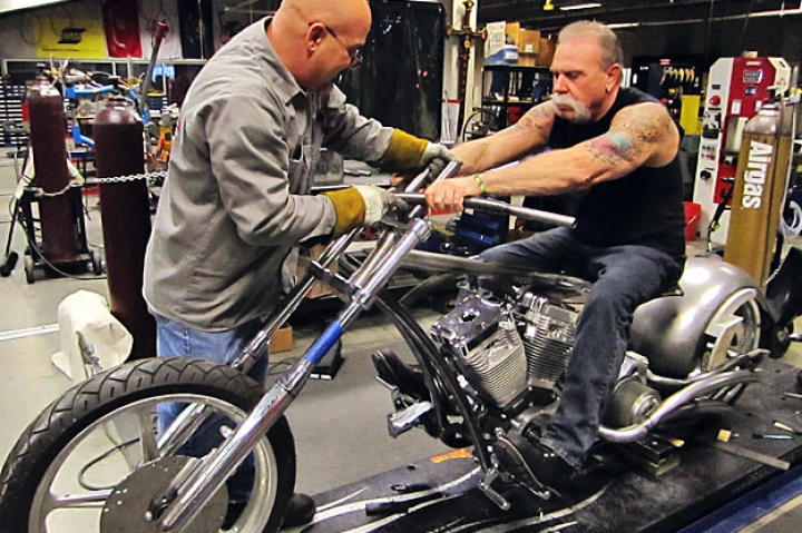 Mike Ammirati and Senior position the Hard Rock Bike's handlebars.