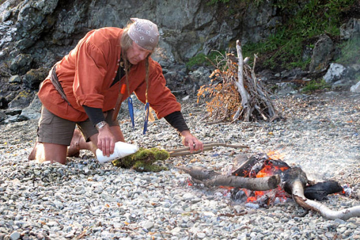 Cody makes torches using moss saturated with motor oil. Slightly damp moss soaked with a heavy fuel makes a excellent slow fire.