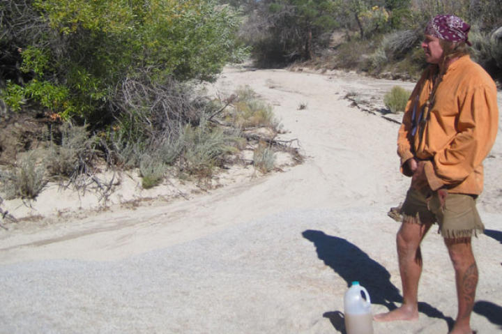 Probing for underground water sources in the most likely spots -- the lowest, well shaded parts of dry watercourses, for example -- Cody recovers a few quarts of silty water. Because it was protected in an aquifer, the water is deemed safe to drink without filtering even if it's not exactly refreshing.