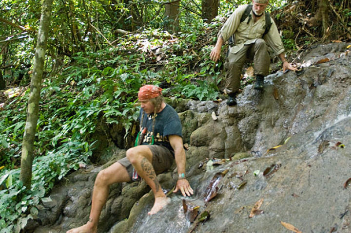 Cody and Dave prepare to set out on their Thai rain forest adventure that begins in rugged highlands covered with jagged limestone formations. In this scenario, the pair take on the situation of ill-equipped eco-tourists lost in a unforgiving landscape with just a Thai jungle knife, steel wool, a sharpening stone, a damaged cell phone and a bag of tobacco.