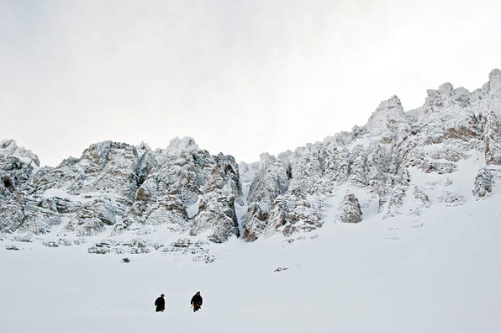Simulating survivors of a high mountain avalanche, Cody and Dave battle through waist-deep snow to get to lower elevations and possible rescue.