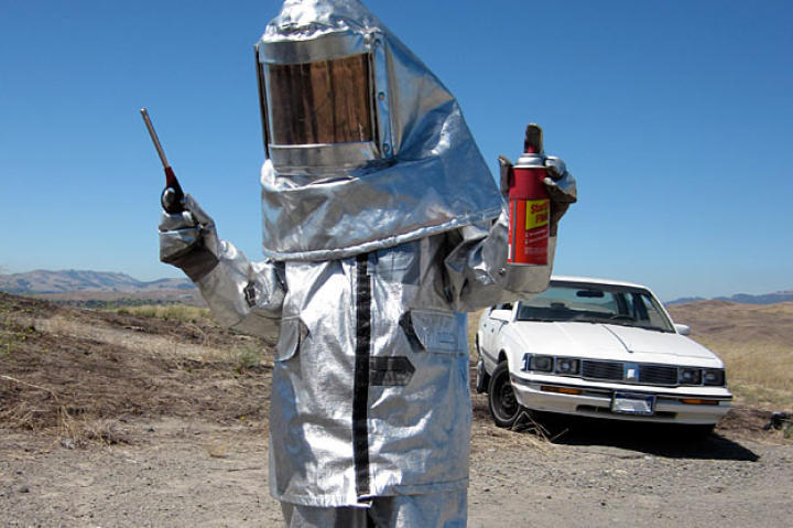 Kari Byron (trust me, it's Kari) dons attire appropriate for testing whether you can really re-seat and inflate a car tire with accelerant (starter fluid, in this case) and a little boom.