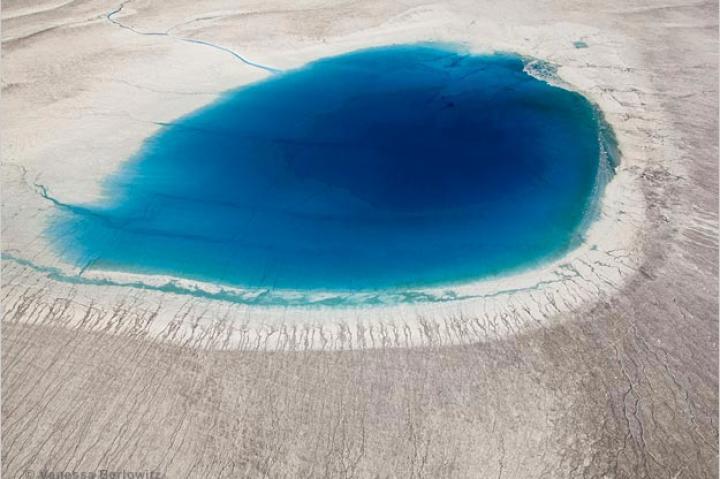 Aerial view of meltwater lake on Greenland's ice sheet.