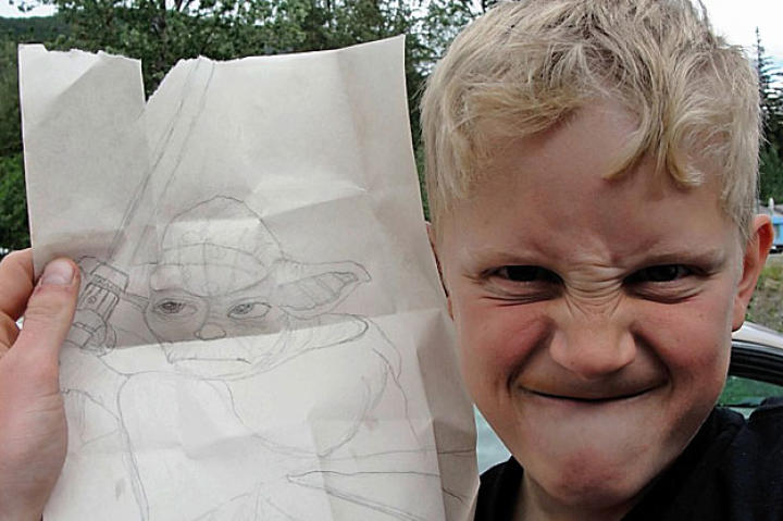 Nine-year-old Hudson Hoffman shows off his Yoda while giving his best impression of a fierce Jedi.