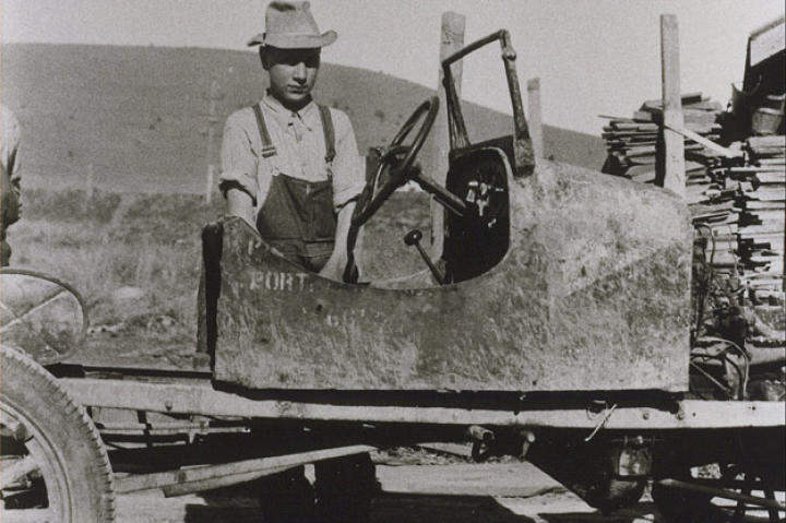 In 1935, John bought his first car, this Ford Model T for two dollars. Not long after he started driving the car some drunk boys ran into him. Instead of involving the police, they paid John $30 and he kept the car. For $1.50 he was able to fix it and continue driving it!