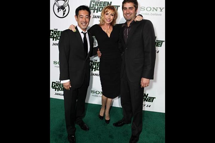 Grant Imahara, Kari Byron and Tory Belleci pose for pictures on the green carpet.