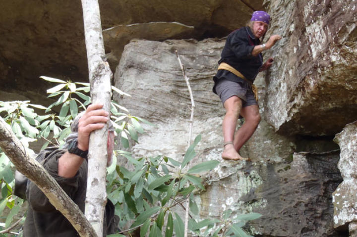 Cody explores along a limestone wall for a good overnight shelter. The limestone outcrops and hills across much of central Appalachia have many recesses and caves that can provide a ready made roof. Native Americans used many of the larger caves and covered ledges for thousands of years.