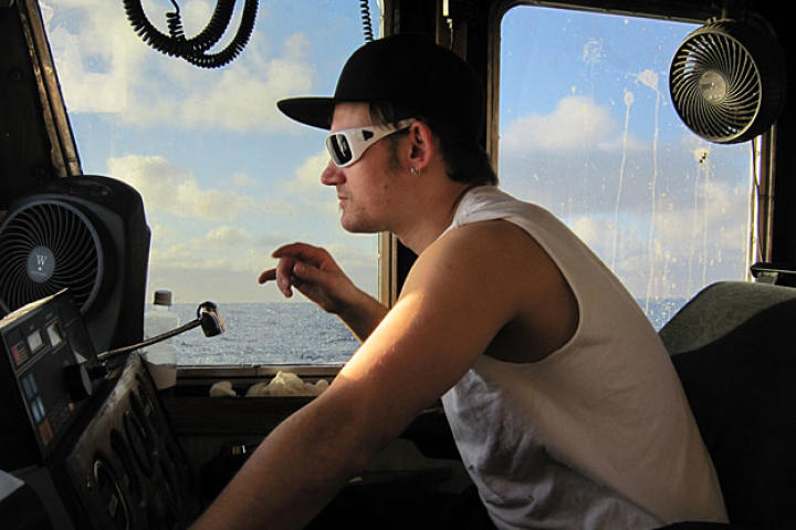 Captain Elliot Neese at the wheel of the Ramblin' Rose.