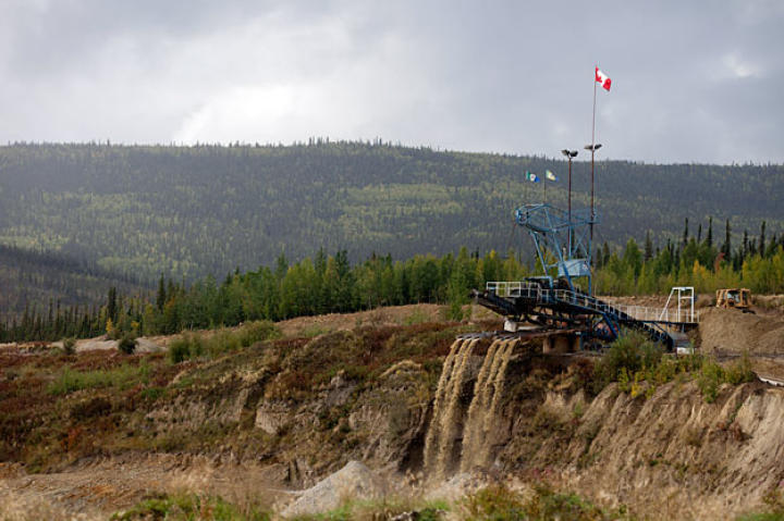 At a claim along the road from Dawson City, a massive wash plant processes multiple tailing streams. Mining operations - past and present - are the most common signs of civilization outside of town.