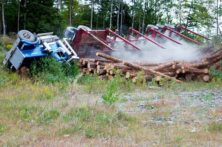 Veteran driver Danny Pelletier narrowly escapes death when his truck rolls on a back logging road.