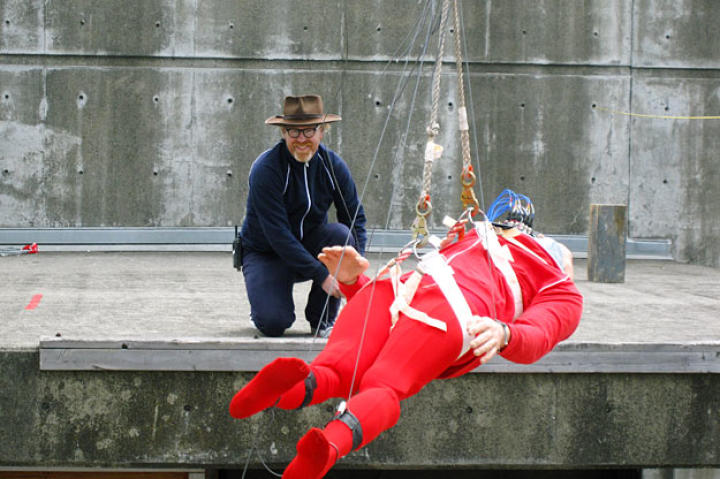 Adam Savage prepares Buster for his fall into a Dumpster. Will Buster survive his rooftop dive into trash, an action-movie staple scene?