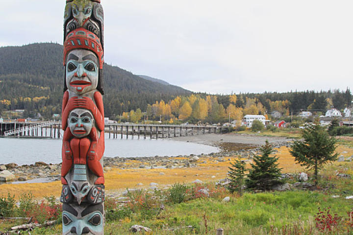 A Tlingit totem standing on the outskirts of Haines, Alaska symbolizes the rich Native American history of the region. The Tlingit reaped bountiful fish harvests from the Chilkat waters for centuries and during the early 1900's, a thriving fish canning industry grew up around Haines. Commercial fishing faded decades ago but the area's pristine beauty, natural wonders and rich history continue to attract thousands of visitors and adventurers.