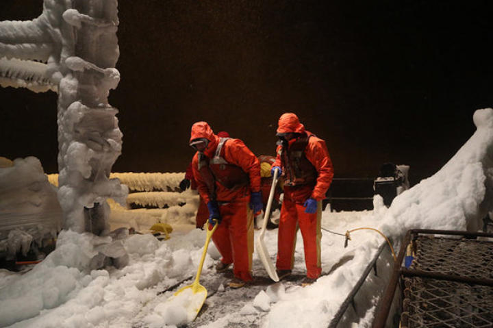 Shoveling the deck of the