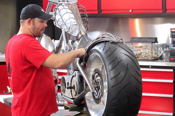Paul Teutul Jr. works on the PJD Bike, a spider-web-themed chopper.