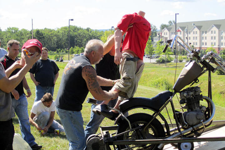 Paul Sr. and the Orange County Choppers crew prepare to launch a dummy dressed as Junior over a creek.