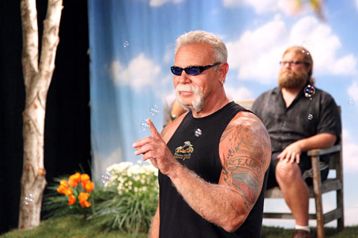 Paul Teutul Sr. faces off against bubbles as Mikey relaxes in the background (July 2009).