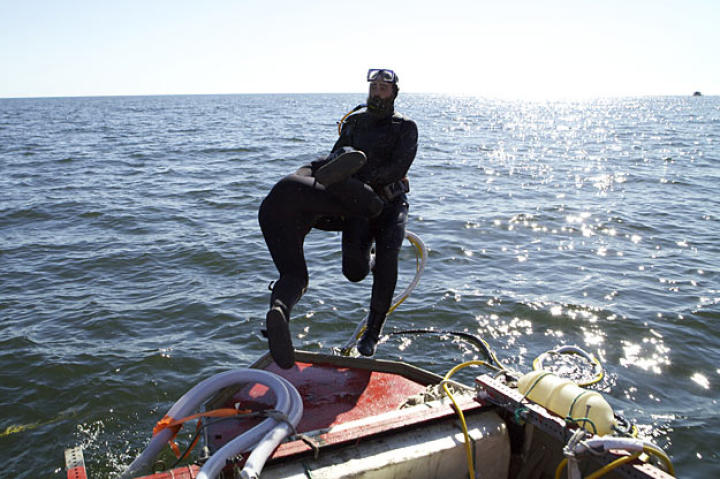 An overexcited Scott helps Ian get into the water.