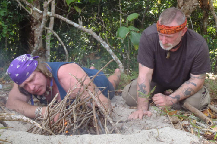 Once ashore, the first priorities always include fire, especially on a remote island where smoke can also serve as a signaling tool. One challenge in this environment is the lack of "sticks" for friction fire methods, but Cody is able to make a few expert adjustments so otherwise smooth bamboo will work.
