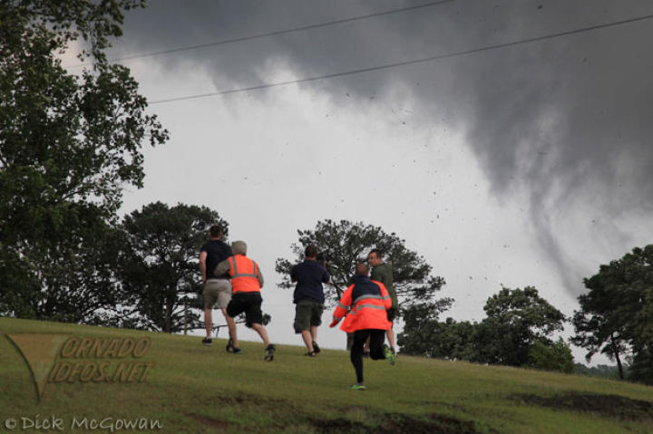 Reed, Chris, Joel and cameramen race over a rise just after the Philadelphia tornado passed and picked up heavy debris, a sure sign that structures were hit. The Storm Chasers crews were able assist a number of residents in the aftermath of the first tornado strikes.