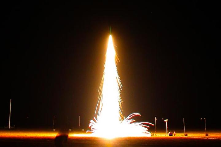Here's an amazing still photo of a night-time rocket launch.