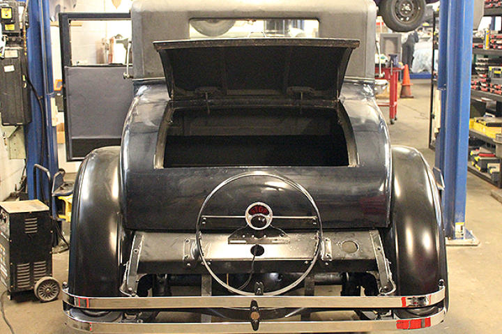 Back bumper of 1926 Velie before renovations begin. Trunk open.