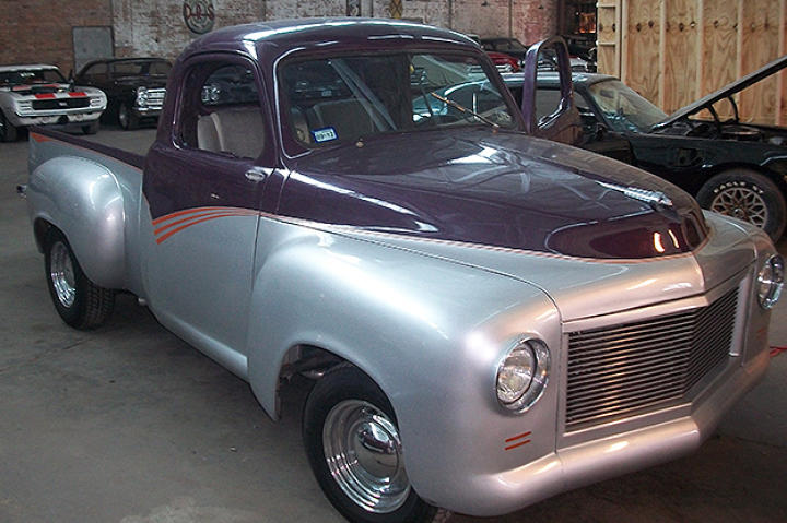 The Studebaker arrives. Three quarter passenger side view.