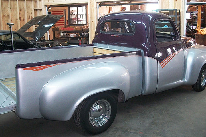 The Studebaker arrives rear passenger side, tail get down.