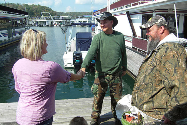 Turtleman and Neal meat Heather Sheperd on her houseboat for a nuisance call.