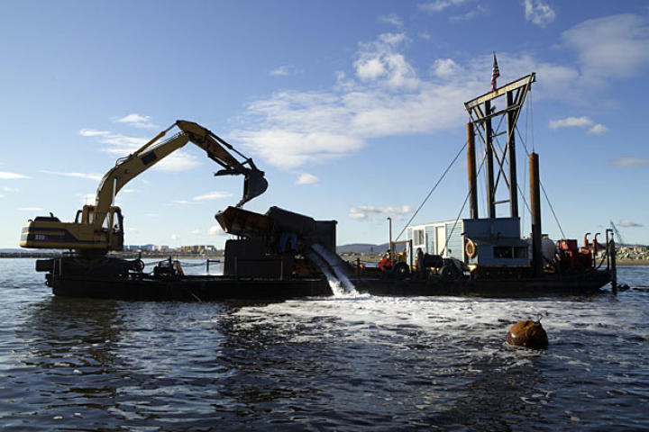 The 80-foot long Christine Rose runs its wash plant while anchored just off-shore. Two 35-foot stakes can be driven into the ocean floor to keep the vessel stable during washing operations.