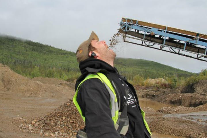 Crew member Ronan Browne opens wide for Quartz Creek tailings.