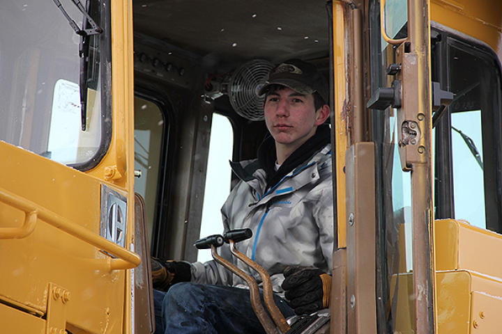 Parker in an excavator.