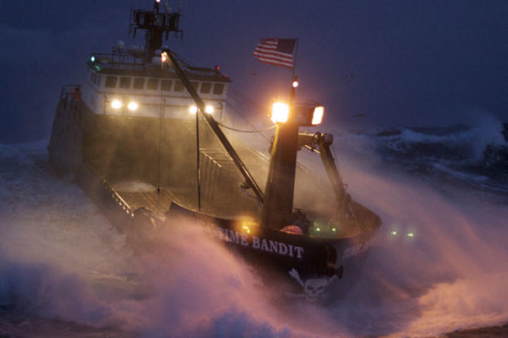 The Time Bandit powers through heavy seas — with her sodium high beams lighting the way.