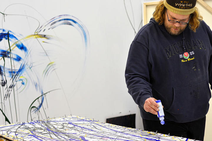 Mikey Teutul at work in his very own art gallery.
