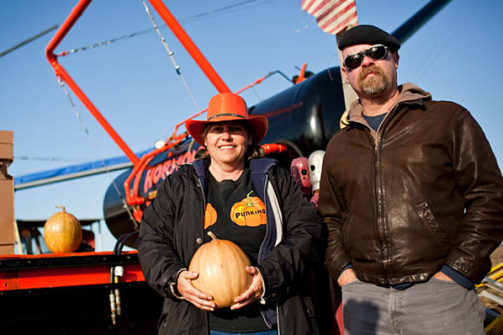 Dawn Thompson poses with Jamie Hyneman — who, along with Adam Savage, hosted this year's Punkin Chunkin competition — in front of her air cannon, Hormone Blaster.