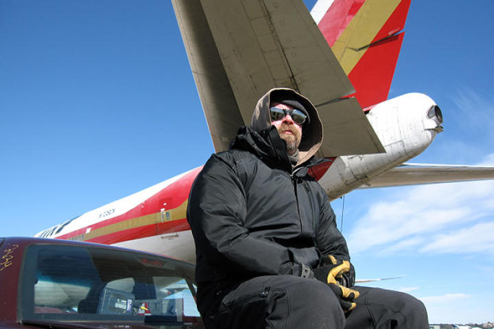 Jamie Hyneman sits below the MythBusters' tornado simulator, a 747 that is capable of blasting out thrust at over 180,000 pounds.